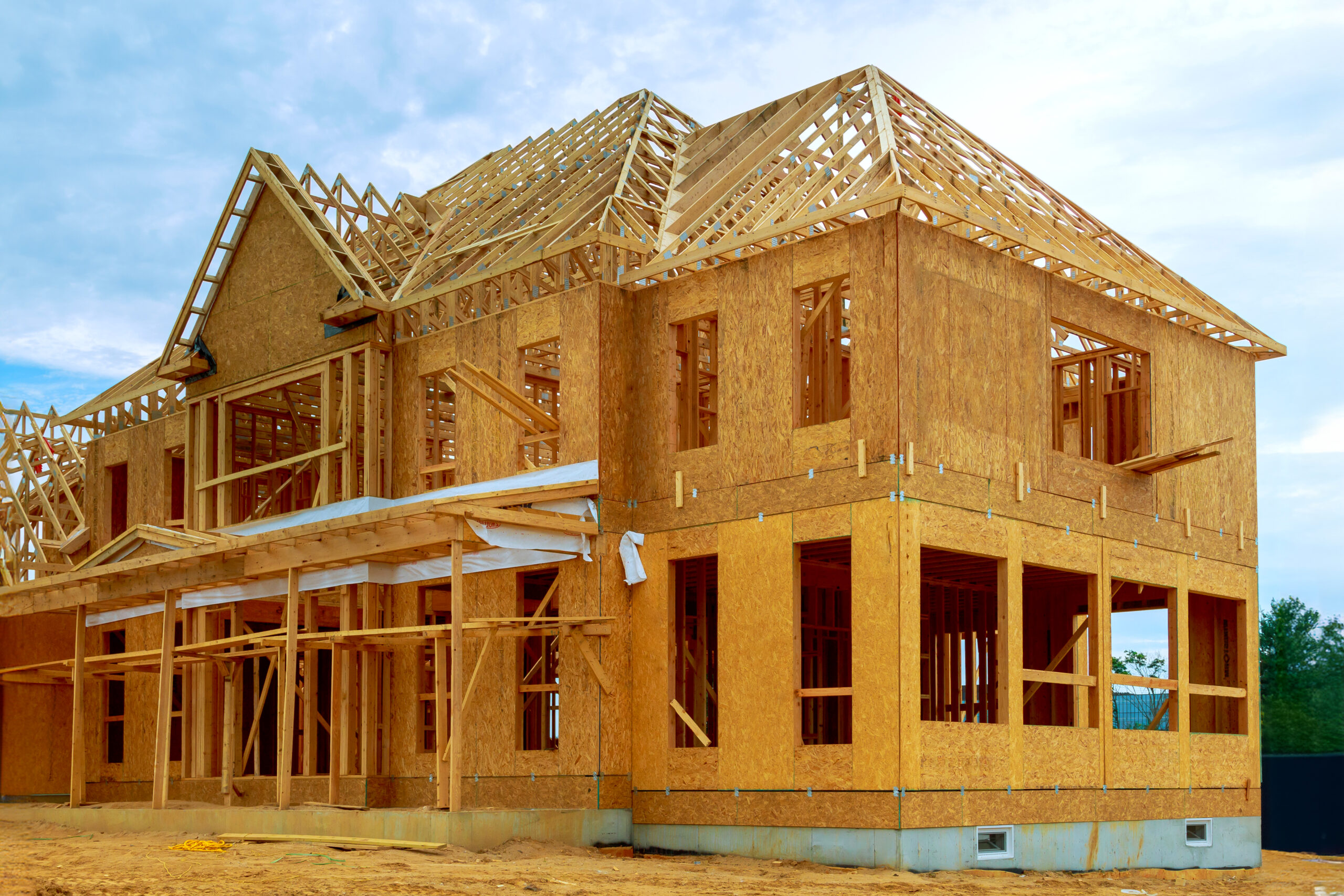 Construction Services Hidden Valley Lake CA An unfinished interior of newly built house with wood framing supports a beam