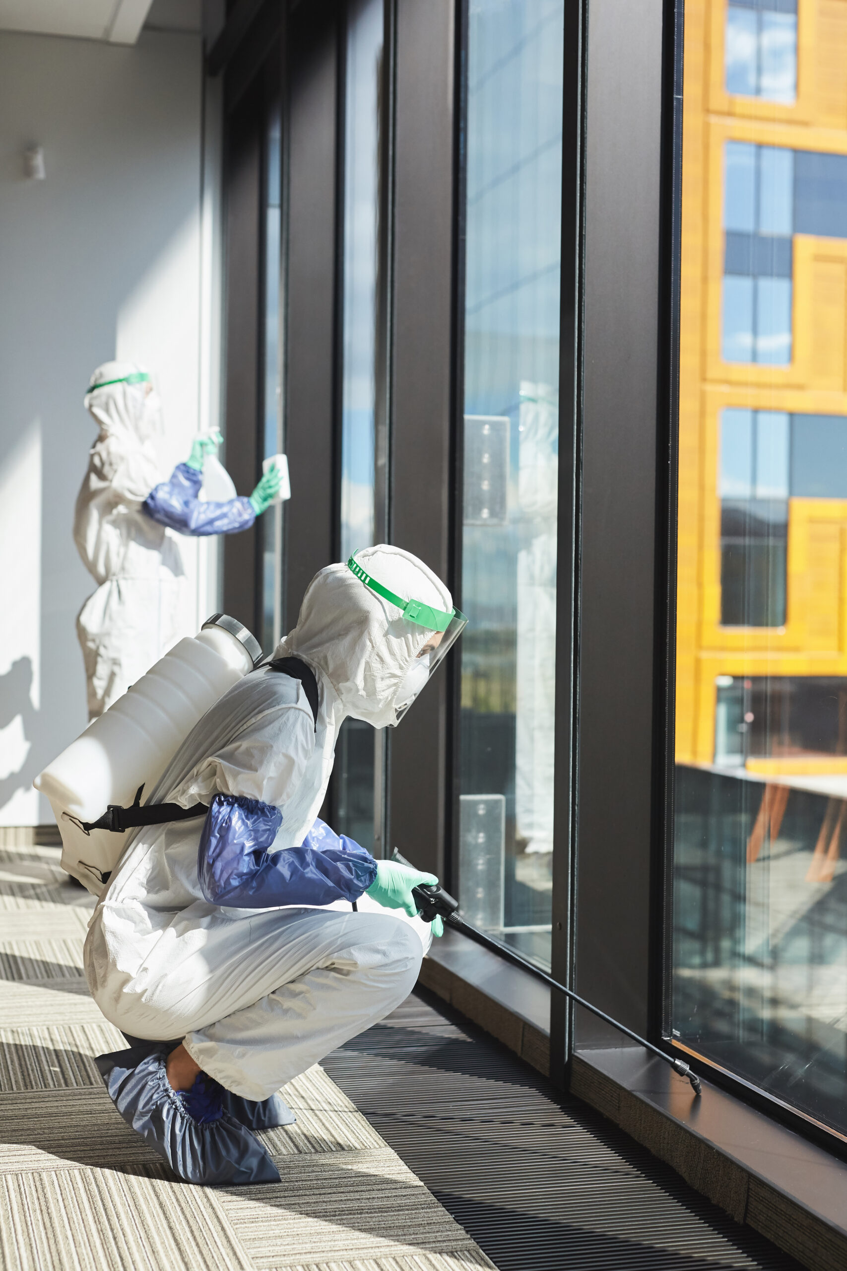 Pest Control Services Apple Valley CA Two Workers Disinfecting Office