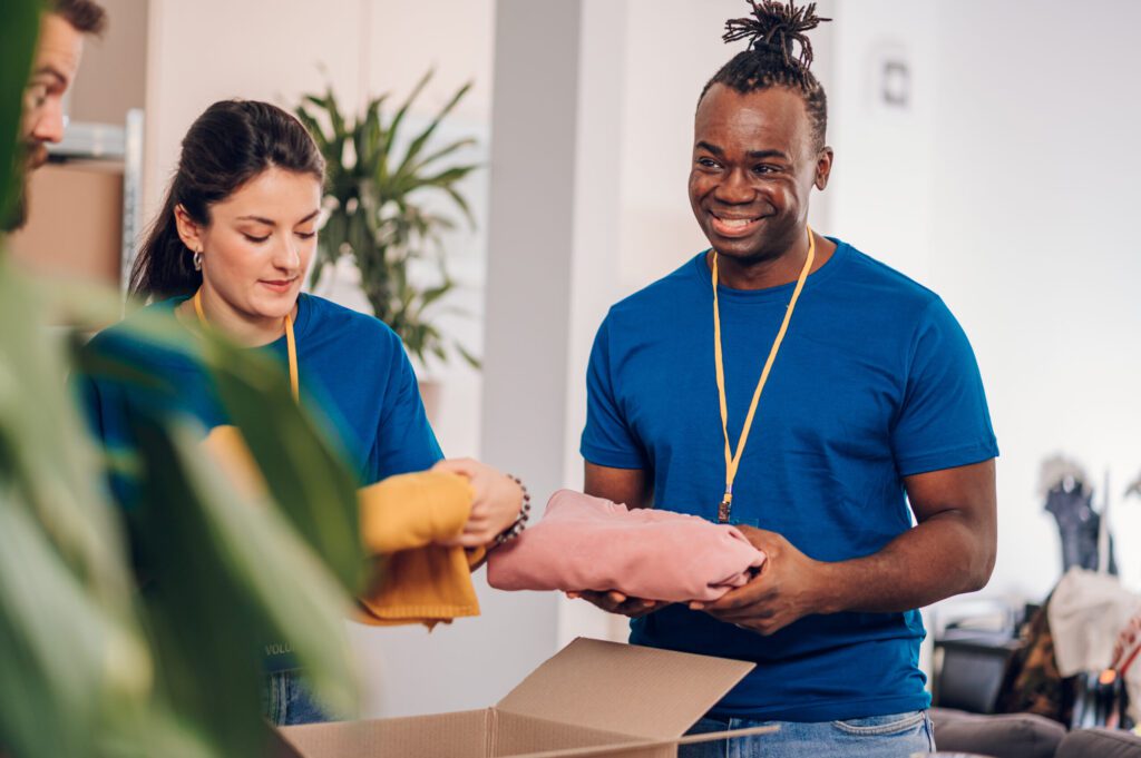 Packing Services in Glendale African american male volunteer working in a charity donation center