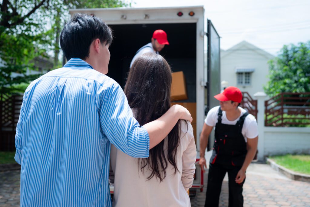 Residential Movers in Los Angeles CA Delivery man delivering parcel to customer at home. Delivery ser