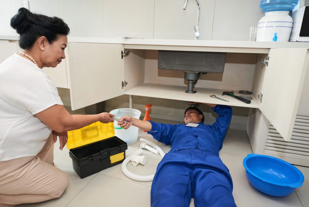 Plumbing Services in Destin FL Plumber fixing pipe